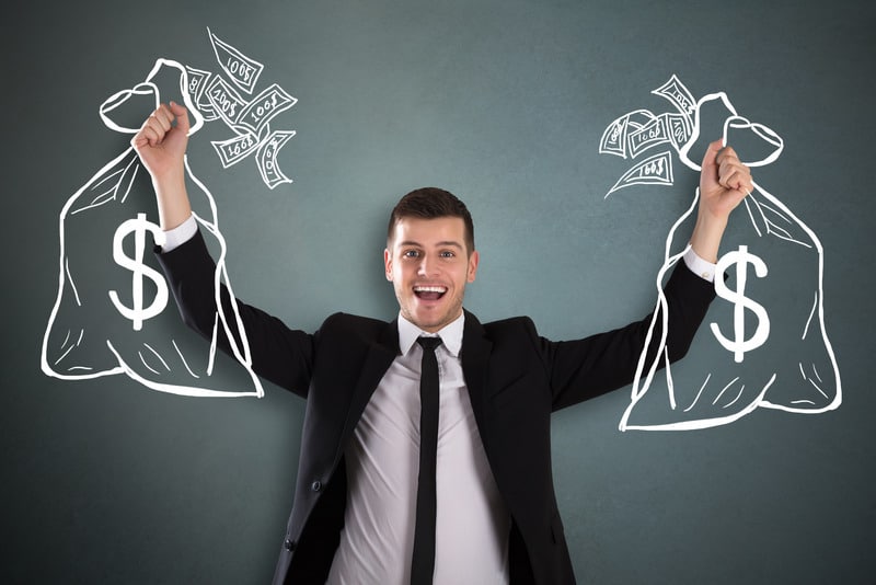 Business man holding drawn money bags